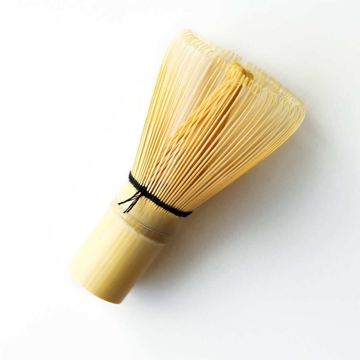 The Matcha Tea Whisk by Hangzhou Green Rock Co., Ltd., features fine, evenly spaced bristles, ideal for whisking matcha tea to perfection.