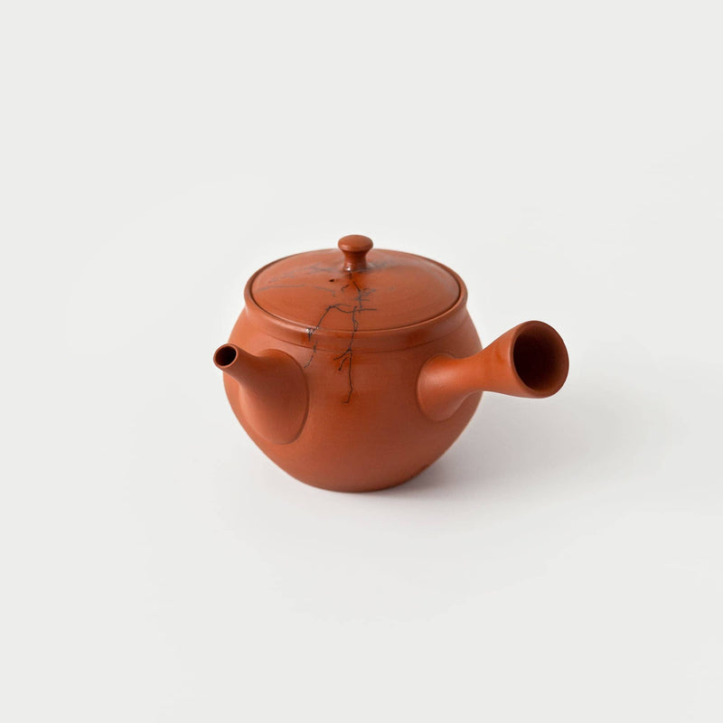 Red shudei clay Tokoname kyusu with a crack repair line across the lid and body.