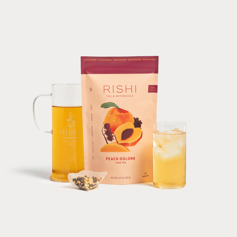 Rishi Peach Oolong Iced Tea package with a glass of tea and a Simple Brew on a white background