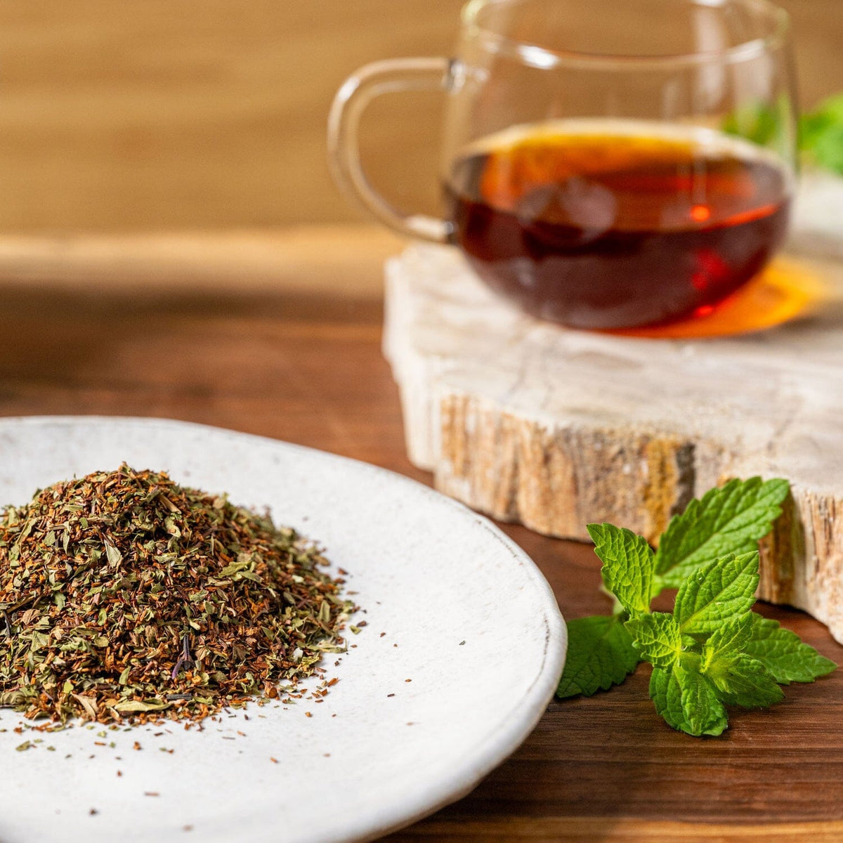 A white plate with a Minty Flight of Tea Bundle from Rishi Tea & Botanicals next to it.