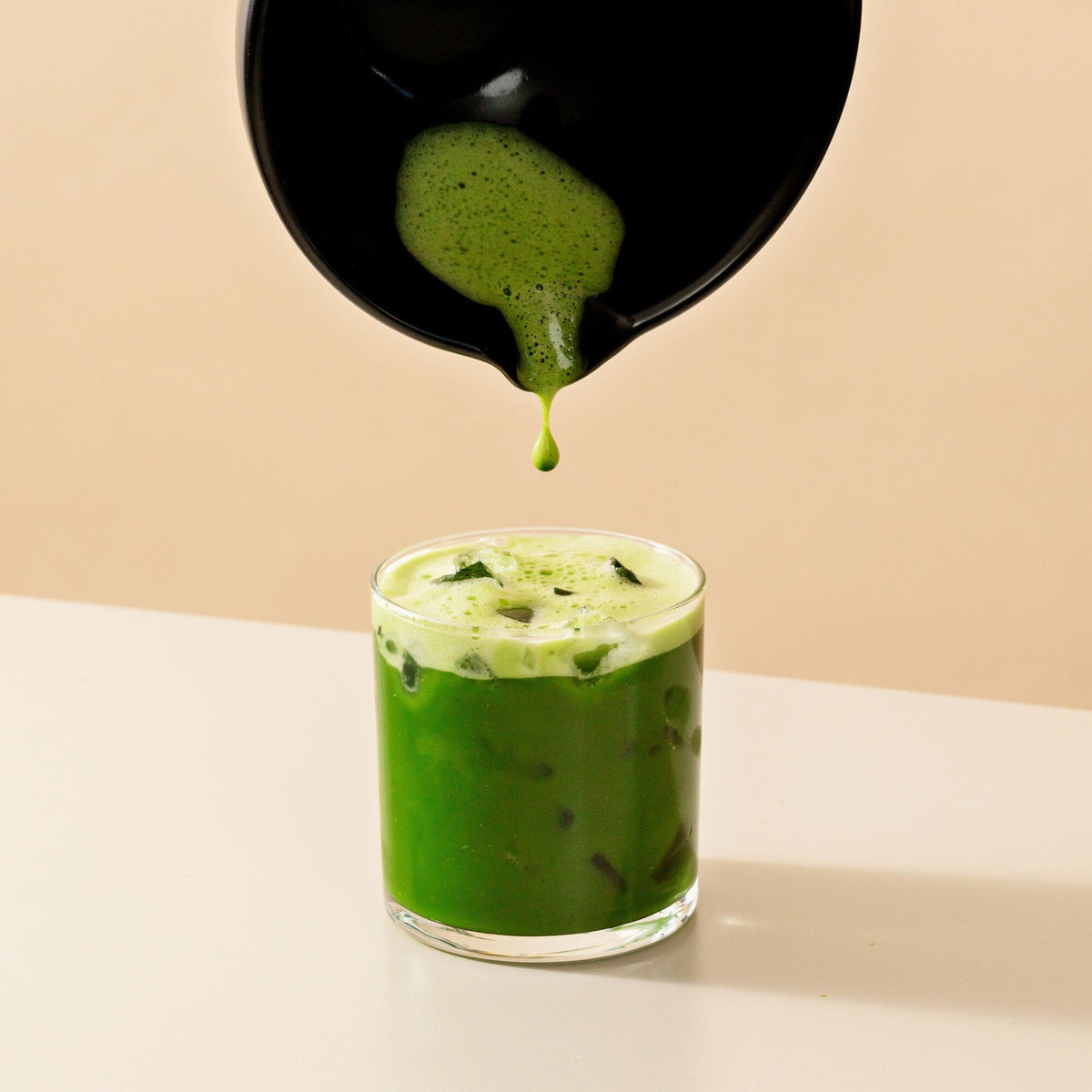 Teahouse Matcha from Rishi Tea & Botanicals being poured into a glass.