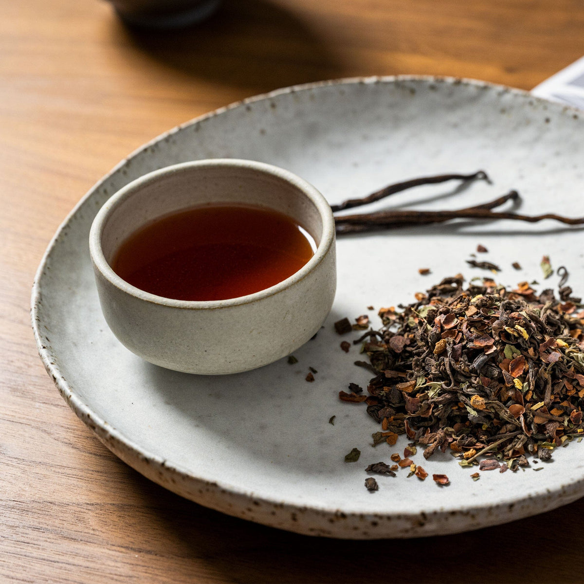A white plate with a cup of Vanilla Mint Chai from Rishi Tea & Botanicals on it.
