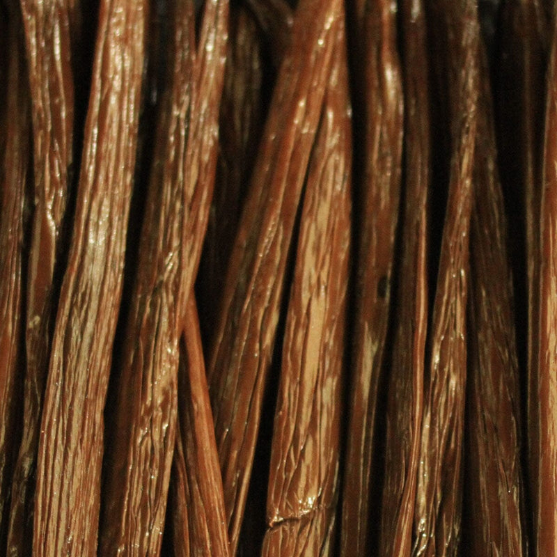 Close-up of dried brown vanilla beans with wrinkled texture—an enticing detail found in premium winter blends such as Rishi Tea & Botanicals' vanilla licorice tea.
