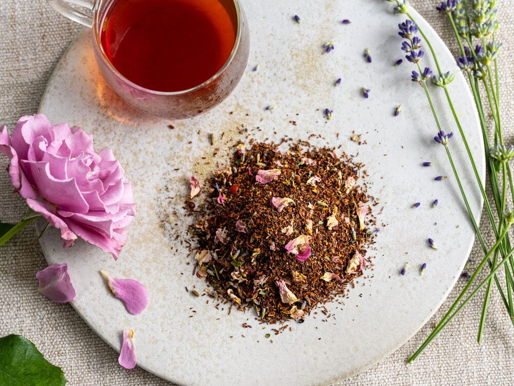 A white plate with a Floral Flight of Tea Bundle and Rishi Tea & Botanicals.