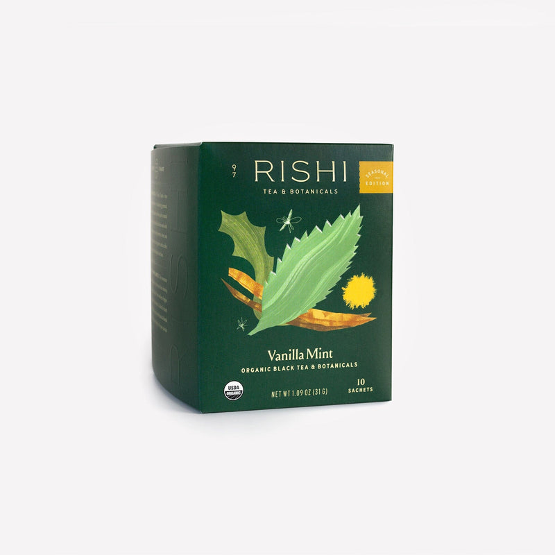 A box of Rishi Tea & Botanicals Vanilla Mint organic black tea, with green and yellow botanical art on a dark green background—ideal for winter sipping or anyone who enjoys peppermint-infused black tea.