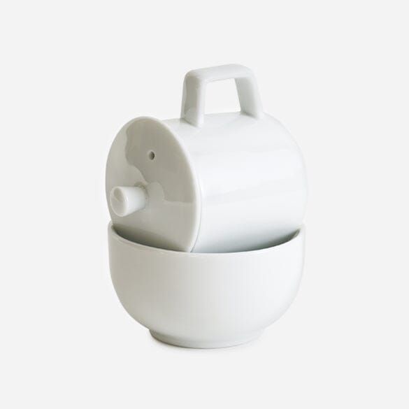 A 3-Piece Porcelain Cupping Set by Rishi Tea & Botanicals, with a lid sitting on top of it.