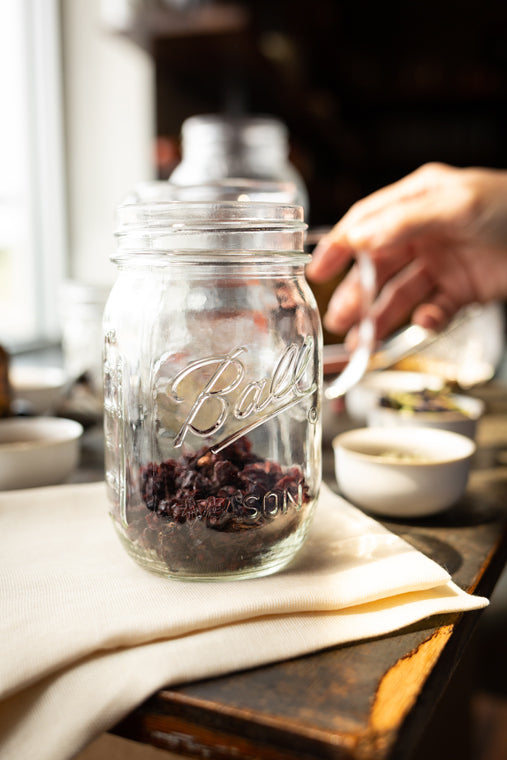 Jar of dried berries on table